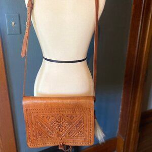 Etched leather cross body bag with horse hair tassle